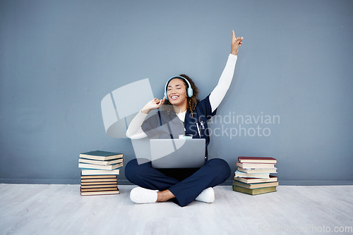 Image of Doctor, laptop or headphones dance to hospital music, podcast or radio in woman study research or mock up learning. Smile, happy or dancing medical student on healthcare technology for books success