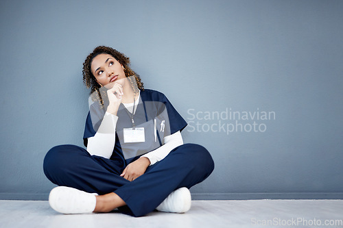 Image of Nurse, sitting or thinking of hospital treatment, medicine innovation or surgery planning on mock up wall. Doctor, woman or healthcare worker and ideas, vision or decision for wellness life insurance