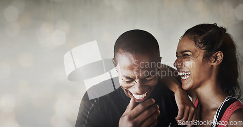 Image of Fitness, happy and couple laughing in a studio after a workout or sports training together. Happiness, smile and excited interracial man and woman athletes by a brown background with mockup space.