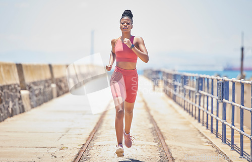 Image of Black woman, running and fitness with runner outdoor, athlete with cardio and speed with run on bridge. Runner, active and sports with workout, exercise and training for marathon or race with mockup