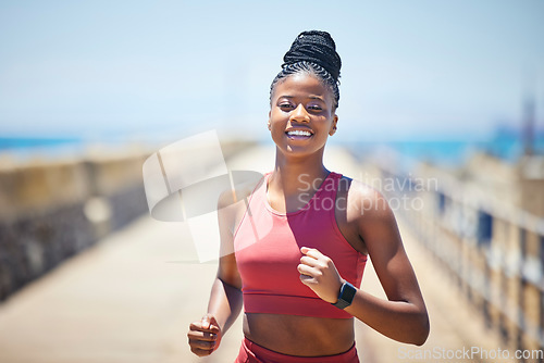 Image of Black woman, fitness and running with smile for workout, cardio exercise or training in the outdoors. Happy African American female runner smiling in run, exercising or marathon for healthy lifestyle