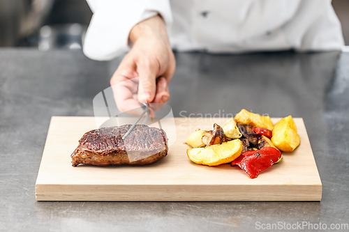 Image of Chef served beef steak