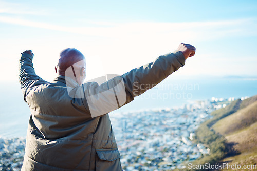 Image of Back, black man and open arms on mountain, hiking and excited for victory, achievement and exercise. African American male, athlete outdoor or guy in nature, gesture for celebration or fitness target