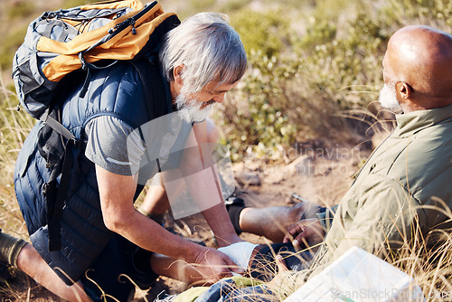 Image of First aid, leg injury and hiking with old men in nature for trekking, adventure and fitness. Help, bandage and medical with friends and knee pain on trail for backpacking, discovery and emergency