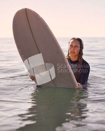 Image of Surfer, woman and swimming in water, sea and ocean for summer adventure, freedom and vacation. Female surfing on board in waves, beach and relax for tropical holiday, nature travel and island sports