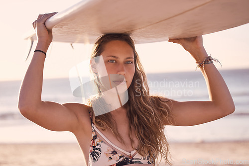 Image of Woman surfer holding board on head at beach for summer, freedom and peace in Australia. Portrait, female and surfing at sea, sunshine and relax for adventure, bikini holiday or tropical island travel