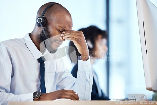 Image of Depression, burnout and stress by call center worker, employee and customer service consultant in office. Pain, mental health and headache telemarking agent overworked and frustrated at the workplace