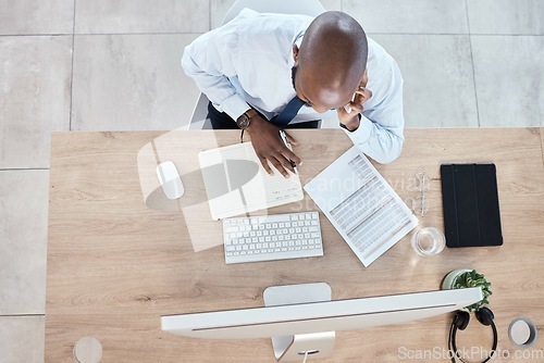 Image of Documents, notes and businessman on phone call planning a schedule or growth strategy for a startup in an office. Overhead, employee or black man working in discussion on mobile conversation