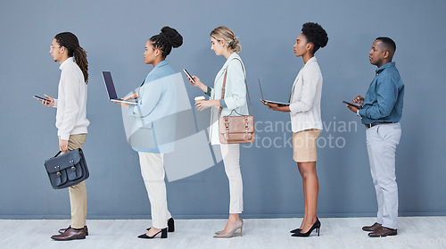 Image of Business people, diversity and job interview waiting in queue, recruitment line or hr technology row. Vacancy, men and women in human resources, hiring or onboarding office on phone, laptop or tablet