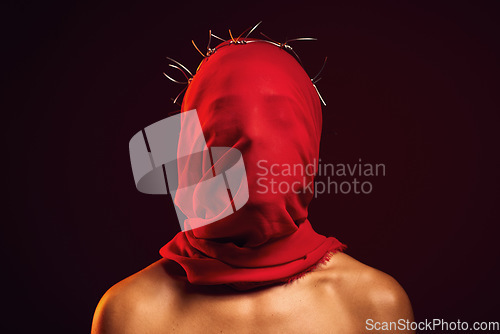 Image of Red fabric, creative aesthetic and religion in a studio with a face covering model for luxury clothing. Glamour, religious crown of thorns and a woman with god respect wearing vintage or silk apparel