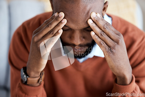 Image of Headache, stress and sad with black man on sofa for burnout, mental health and anxiety. Depression, thinking and frustrated with guy in living room suffering with problem, worried and exhausted