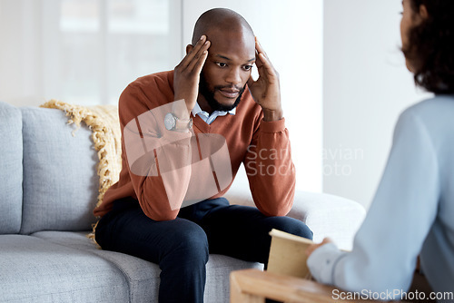 Image of Black man, mental health and therapy with stress headache, psychologist and depression with help. Psychology consultation, doctor with patient and discussion about anxiety problem, sad and depressed