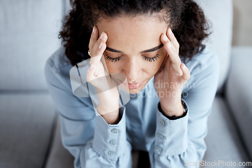 Image of Stress, headache and woman at psychology for mental health, grief or depression counseling. Frustration, anxiety and sad stressed female patient sitting on sofa with migraine at psychotherapy session