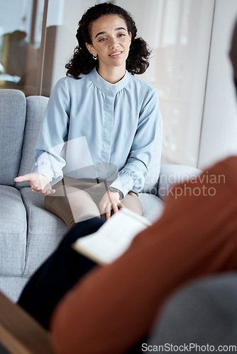 Image of Mental health, talking and black woman in therapy session, depression and discussion for stress, grief or loss. African American female, patient or lady with anxiety, conversation for help or anxious