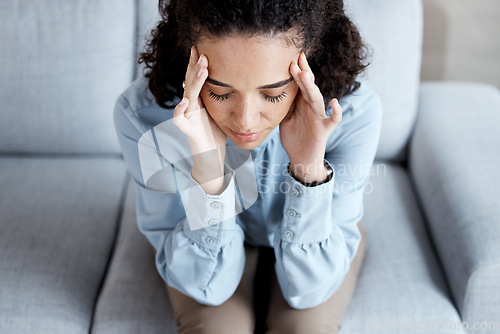 Image of Headache, stress and anxiety with black woman on sofa for burnout, mental health and sad. Depression, thinking and frustrated with girl in living room suffering with problem, worried and exhausted