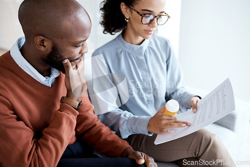 Image of Therapy, mental health pills and man with depression, trauma or stress on psychologist couch. Person talking to woman therapist for psychology and anxiety prescription document for help or support