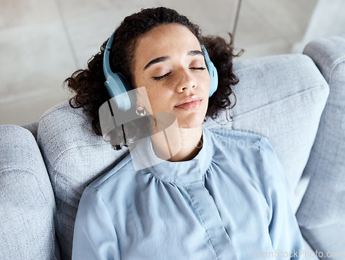 Image of Headphones, woman and face for listening to music for calm, peace and mental health on home couch. Young person on living room sofa listen to podcast, audio or motivation to relax or meditation above