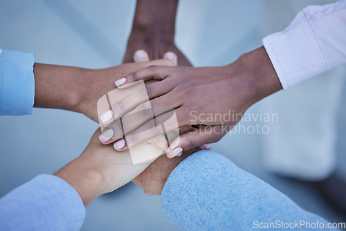 Image of People, trust and hands together above for community, unity or team agreement in support for collaboration. Hand of group in teamwork, motivation or coordination for win or partnership in solidarity