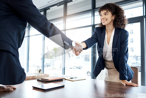 Image of Business people, handshake and smile for b2b, interview or partnership in teamwork at the office. Happy female executive shaking hands with employee for meeting, greeting or introduction at workplace