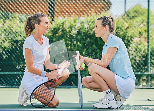 Image of Tennis, teamwork and strategy with a woman doubles player talking to her partner on a sports court. Fitness, workout or exercise with a female athlete partnership training as a team outdoor for sport