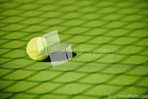 Image of Tennis ball, court shadow and green texture of grass turf game with no people. Sports, empty sport training ground and lawn object zoom of shadow for workout, exercise and fitness for a match outdoor