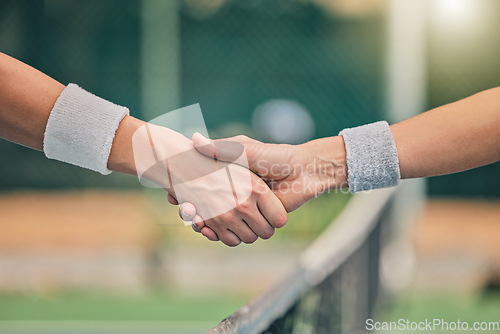 Image of Hand, tennis and handshake for partnership, unity or greeting in sportsmanship at the outdoor court. Players shaking hands before sports game, match or trust for deal or agreement in solidarity