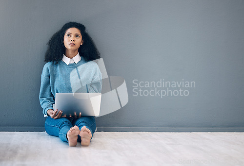 Image of Laptop, thinking and idea with black woman on floor for social media, news and research on wall mockup . Designer, online shopping and technology with girl for communication, internet and marketing