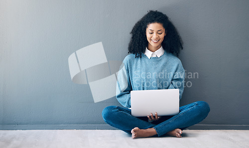 Image of Laptop, happy and research with black woman on floor for social media, news and designer on wall mockup. Website, online shopping and technology with girl for communication, internet and advertising