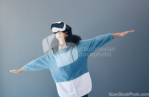 Image of Metaverse, virtual reality headset and gaming black woman with hands for 3d flying game in studio. Gamer person vr glasses in digital world, futuristic app and ar tech ux experience grey background