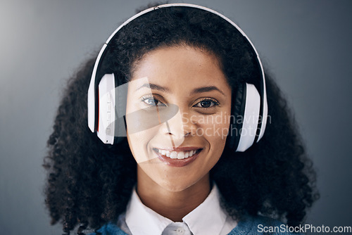 Image of Headphones, music and portrait of black woman with smile on wall background listening to audio, radio and song. Relax, calm and face of happy girl for peace, mindset and streaming wellness podcast