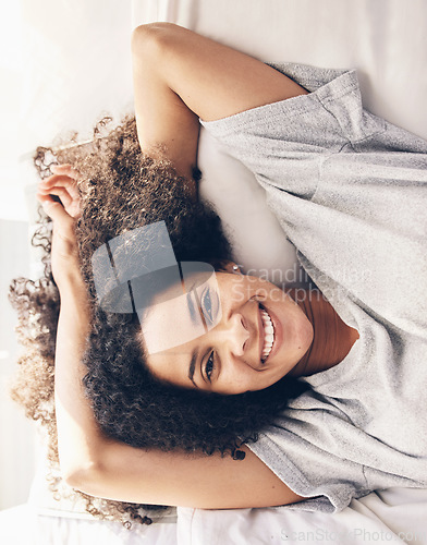Image of Black woman, wake up and top view portrait in bedroom after sleeping or resting. Peace, bed relax and comfort of happy female awake after sleep on comfortable pillow and blankets for healthy rest.