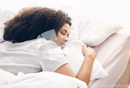 Image of Sleeping, comfortable and black woman in bed for rest, relax and stress relief. Night, nap and African girl lying in a bedroom while tired with fatigue, pillow and blanket while dreaming and resting