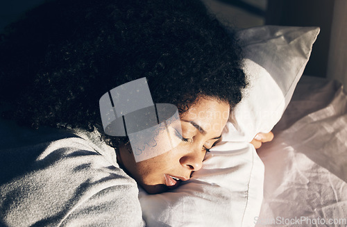 Image of Sleep, black woman and bed in morning for peace, quiet and rest or relax in home bedroom. Person face on pillow to dream or for calm sleeping with insomnia or fatigue therapy for health and wellness