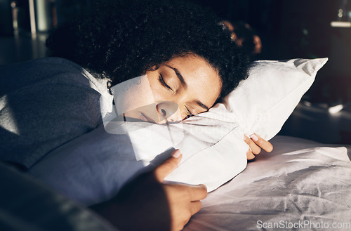 Image of Black woman, sleeping and pillow in morning for peace, quiet and rest or relax in home bedroom. Person on bed to dream or for calm sleep with sleepy or stress relief for health and wellness