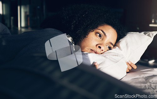 Image of Anxiety, depression and woman in bed with insomnia, thinking and trying to sleep while sick. Morning, sunrise and sad and depressed girl with stress, mental health problem and fatigue in bedroom