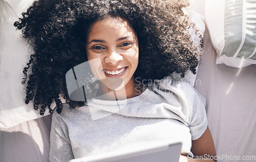 Image of Black woman, tablet and top view in bed in bedroom for social media, texting or internet browsing in the morning. Portrait, relax and female on digital touchscreen for web scrolling or networking.