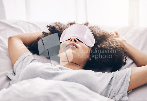 Image of Black woman, sleeping mask and bed in morning for peace, quiet and relax in home bedroom. Person on pillow to dream for calm sleep with insomnia or fatigue therapy for health and wellness in room