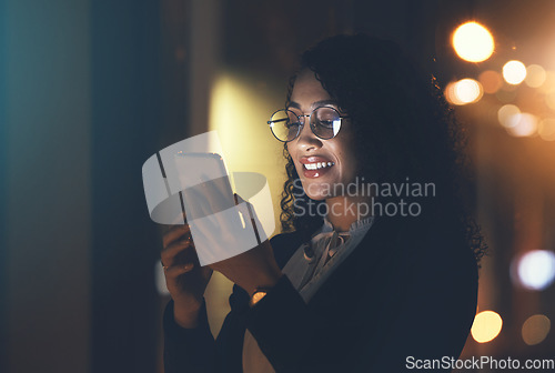 Image of Night, business and woman with smartphone, typing and smile for achievement, new project and social media. Late, female and girl with cellphone, connection and overtime with device and online reading