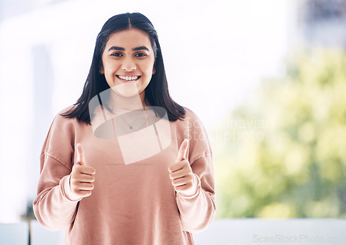 Image of Thumbs up, success and portrait of business woman in office for thank you, welcome and leadership gesture. Corporate, support and female worker smile with hand sign for approval, yes and agreement