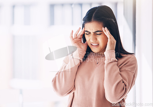 Image of Headache, stress or mockup with an indian woman on a blurred background suffering from pain or anxiety. Compliance, mental health or burnout and a frustrated young female struggling with a migraine