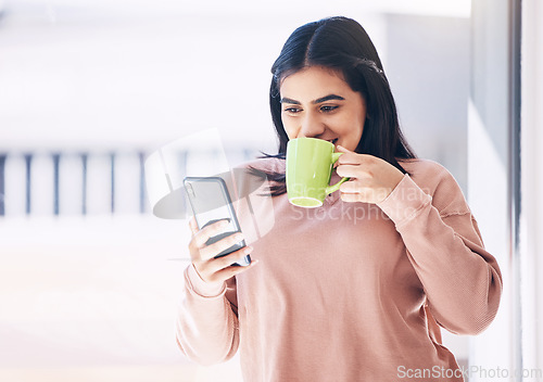 Image of Student, phone or drinking coffee in house, home or penthouse apartment on social media app, internet or dating website. Happy smile, woman and relax tea cup, mobile blog or communication with mockup