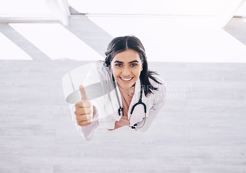 Image of Top view, portrait or doctor thumbs up for success, vote or clinic approval for hospital life insurance or winner trust on mock up. Smile, happy or yes hands for healthcare worker woman in wellness