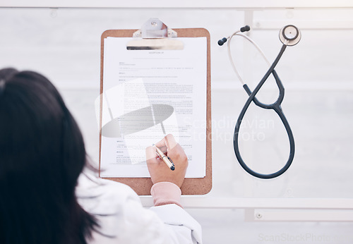 Image of Top view, hands or doctor writing on clipboard hospital prescription, medical research or signing consulting form. Woman, stethoscope or healthcare paper documents for wellness life insurance or help