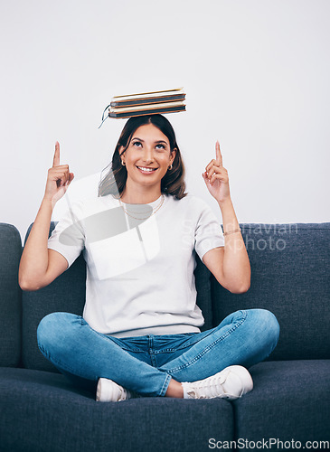 Image of Woman with books on head, space mock up and balance for study, education or university reading or scholarship. Knowledge, learning and history, philosophy or English college person pointing to mockup