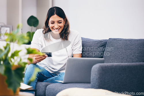 Image of Ecommerce, laptop or woman with credit card happy with digital payment while relaxing on sofa at home. Smile, finance or girl excited with online shopping subscription discount, sales offer or deal