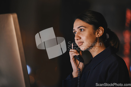 Image of Office, night and business woman on a phone call for communication, networking and customer support. Receptionist, secretary and female on telephone for online feedback, telemarketing and connection