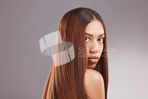 Image of Black woman, hair care and studio portrait for healthy shine, beauty and wellness by gray background. Young gen z model, girl and cosmetics for growth, keratin health and aesthetic with confidence