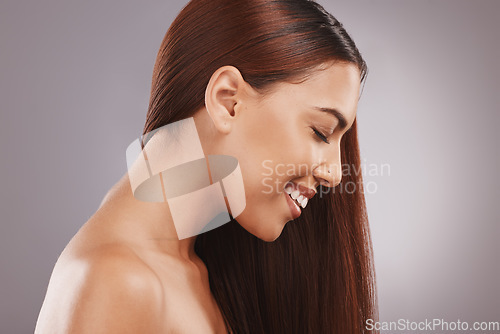 Image of Salon, beauty and hair with a model black woman in studio on a gray background for natural treatment. Aesthetic, face and haircare with an attractive young female posing to promote keratin benefits