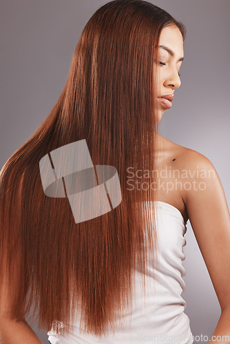 Image of Black woman with straight brown hair isolated on studio background for healthy glow, beauty shine or care. Young USA model or person for natural growth, red dye color and salon hairdresser treatment