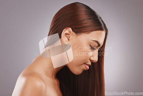 Image of Face, salon and hair with a model black woman in studio on a gray background for natural treatment. Aesthetic, beauty and haircare with an attractive young female posing to promote keratin benefits